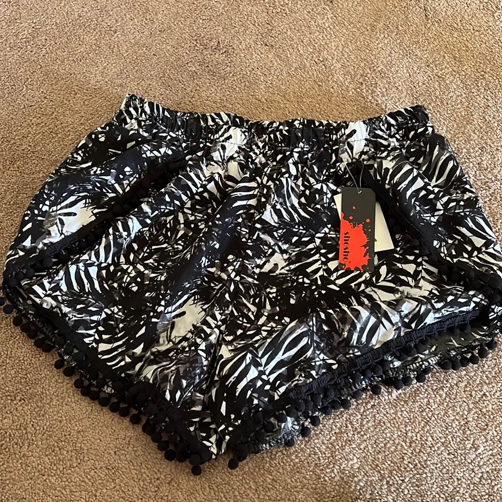 Brand new shorts, perfect to wear over bathing suit!